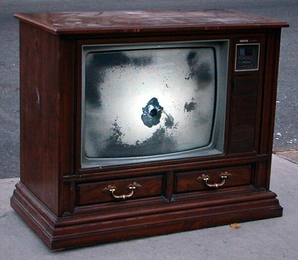 sorabji.com: Television with a bullethole through it, New York City