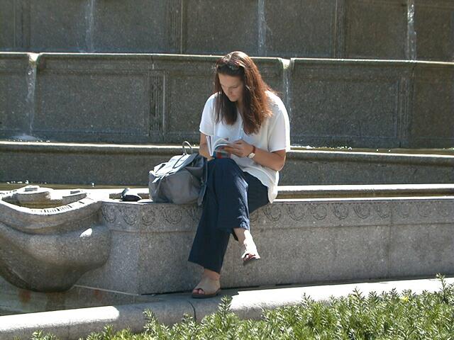 sorabji.com: Woman sitting outside Trump Plaza, Manhattan