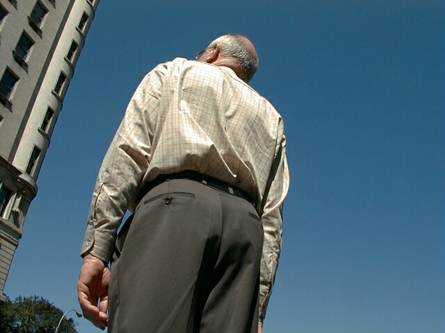 sorabji.com: Man standing outside Trump Plaza, Manhattan