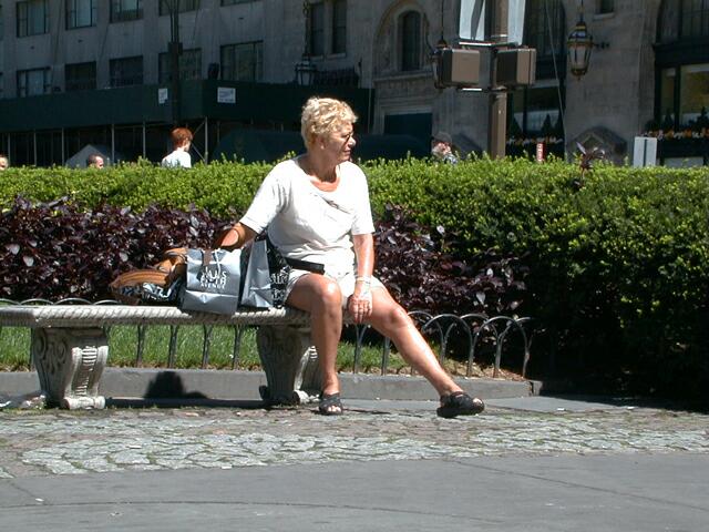 sorabji.com: Woman sitting outside Trump Plaza, Manhattan