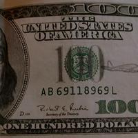 Airplane on a $100 Bill