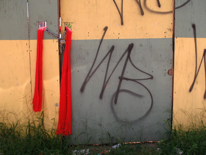 sorabji.com: Red Scarf Locking Down a Construction Site